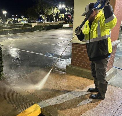 Pressure washing shopping center maintenance program.