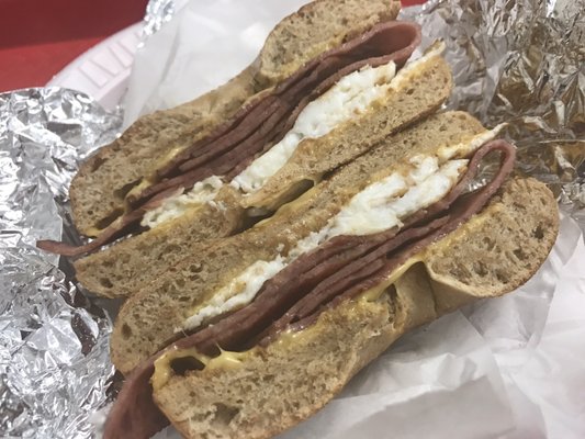 Egg whites, turkey bacon and one slice of cheese on a toasted whole wheat bagel