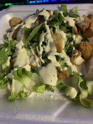 Takeout Caesar salad.