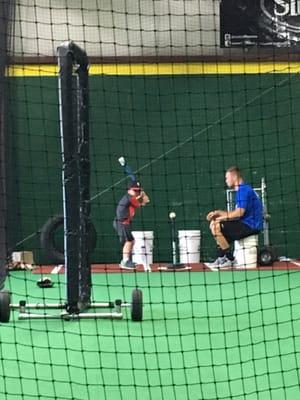 Ryan Wright giving a hitting lesson.