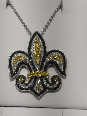 New Orleans Saints football logo with yellow, black & white diamonds.