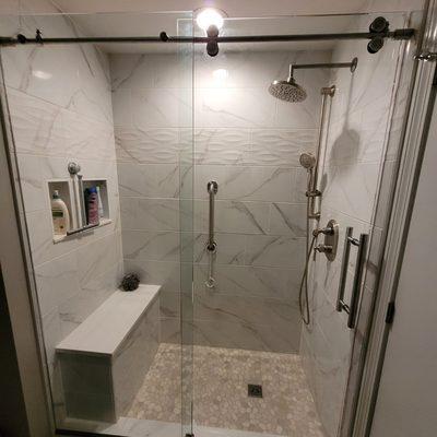 Tile shower in part of a bathroom remodel