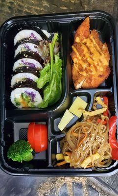 Combo Bento Box, with Katsu pork cutlet, vegetable kimbap, vegetable japche noodles, pickled daikon.  Everything fresh and delicious.