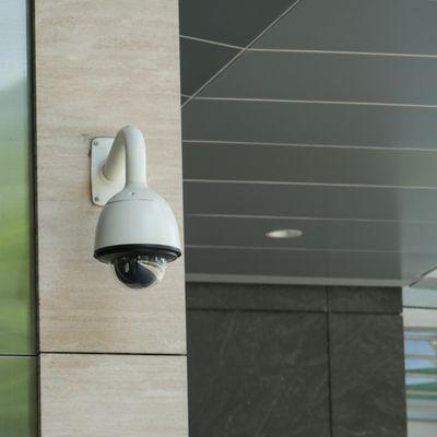 Performin security camera installed on a commercial property