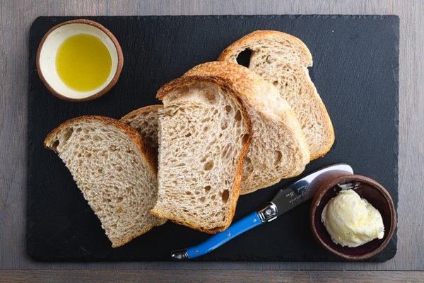 Bread Service. Traditionally made from Grover Beach Sourdough. Served with Cultured Butter and Organic EVOO