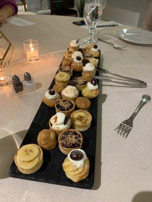 Dessert selection with mini pies, mini tarts, crème puffs and more!