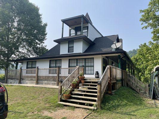 New siding and 50 year shingle roof backed by the manufacturer