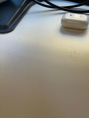 Hair on desk, wasn't wiped down.