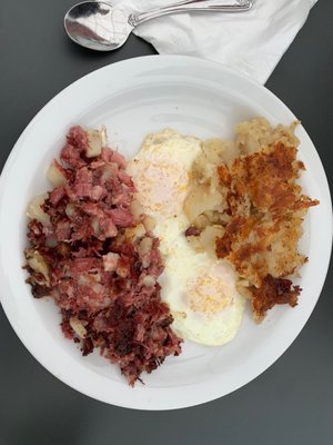 Corned beef hash, two eggs over easy and hash browns