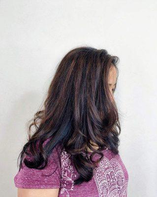 Long layers, caramel highlights, and root touch-up.