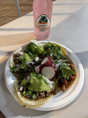 2 al pastor and 2 carne asada with a guava Jarritos.