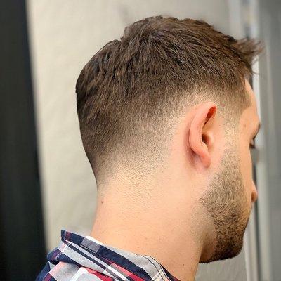 Low skin fade Haircut with textured top and beard sculpt/trim