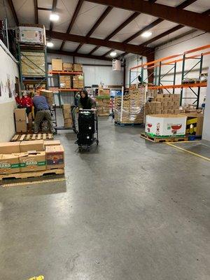 Pallets Of food are being built to send out to the teams and the members of the team as well distributed amongst each other