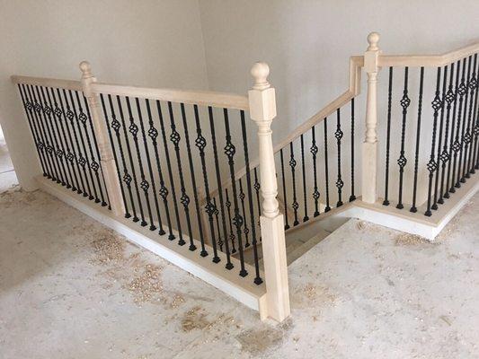 Not yet stained maple with iron basket balusters