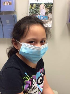 My eldest child sick with the flu. She hated the mask on her face. She was too sick to fight me much on that decision.