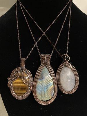 Copper wire-wrapped pendants in a variety of stones.