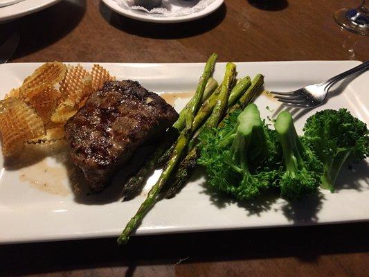 7 oz tenderloin with asparagus and broccoli. Also a few delicious chips on the side.