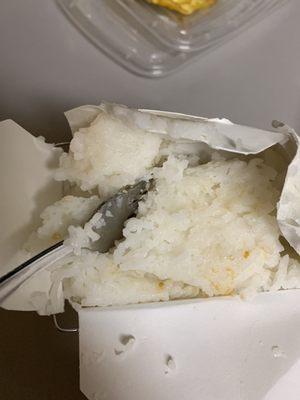 Mushy, poorly cooked white rice that they thought was suitable to serve to people. Inedible.