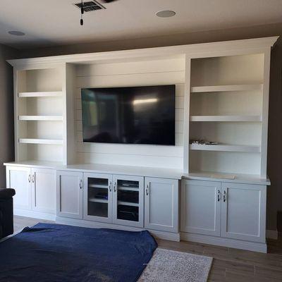 Entertainment Center in white shaker style and ship lap.