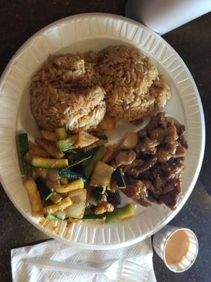 Teriyaki chicken, fried rice, zucchini and onions.