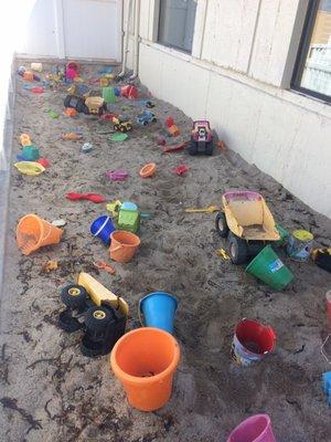 Big sand box with toys