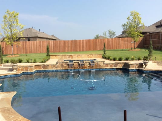 This is a custom designed pool for our client Trisha in the backyard of her new home in Rowlett.