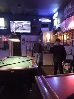 Pool table and friendly crowd