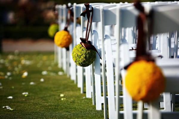 A side view of our white comfort folding chairs set up for an outdoor event. Did you know that you can schedule an on-site meeting with us?