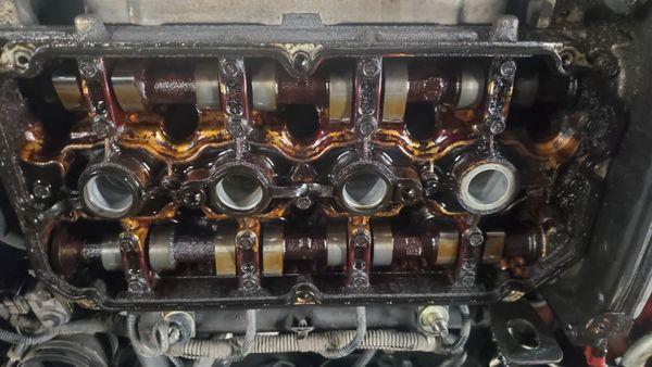 Top of engine with high heat baking the oil 220,000 miles