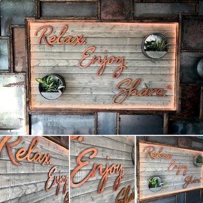 Custom, dimensional acrylic letters made to look like rusted metal.