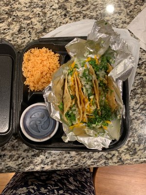 Chicken taco plate with rice and black beans.