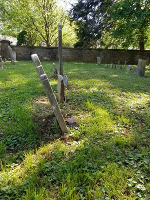 Before this stone was reset. I'm sure it has been that way for a long time. It belongs to Peter Williamson and his wife, Sarah.