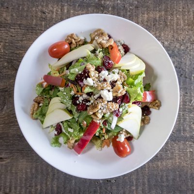 "PRODOTTO" Greens, pear, dried cranberries, walnuts, red pepper, red onions, tomatoes, gorgonzola, balsamic vinaigrette