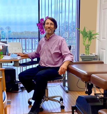 Dr. Steve Solloway, Acupuncturist, Chiropractor & Oriental Medicine enjoying his office