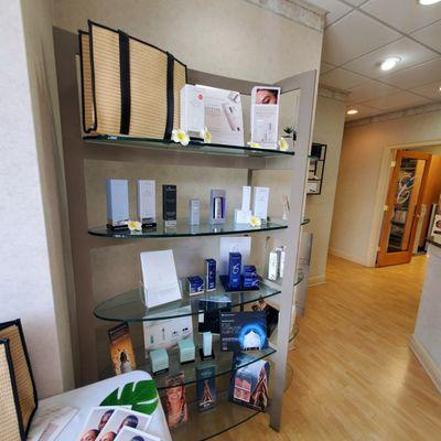 Some of the skincare products that are available at Cosmetic Surgery Center on display in the lobby.