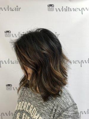 Layered lob with glazed subtle highlights.