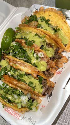 5 Carne asada toasted tacos on corn tortillas