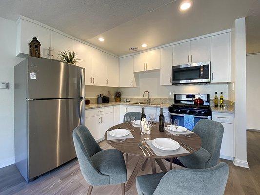 Studio dining area and kitchen at Mediterranean Village Apartment Homes