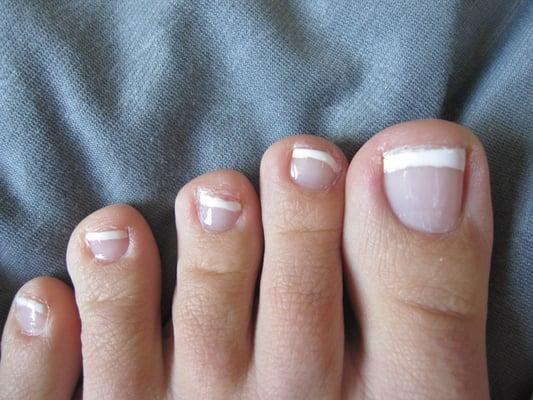 French pedicure.  Edges very uneven.  Done by male, I don't know his name.