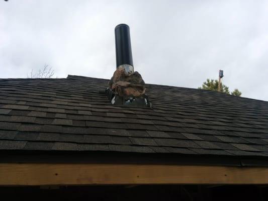 Chimney still under construction, can see the sloppy and ugly flashing done by the roofing crew.