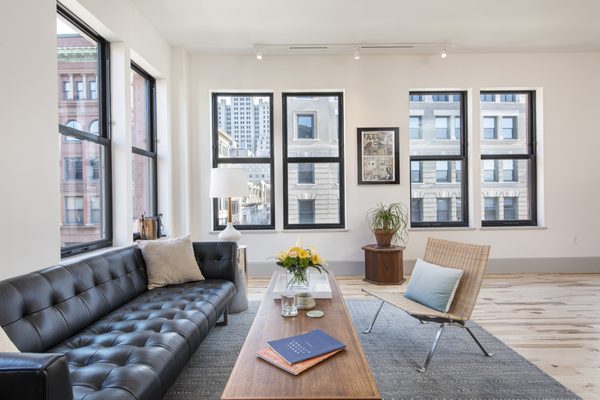 Captivating corner windows in this living room of a two bedroom in the Lapham building.