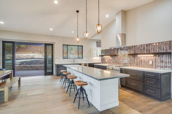 Love this kitchen and the dynamic backsplash and open shelves!