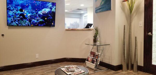 receptionist desk (video aquarium, relaxing music, reading material, complimentary k-cup coffee or bottled water while you wait)