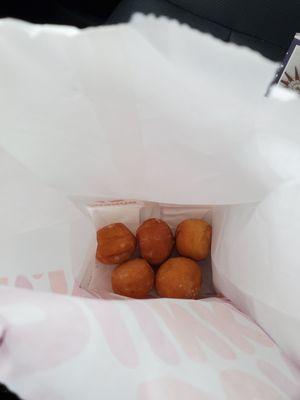 Munchkins just drops in the carry out bag not the little bag they are usually put in first then in carry out bag.