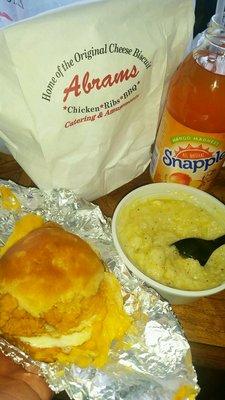 Chicken Cheese Egg and Cheese Buscuit w/side of Grits