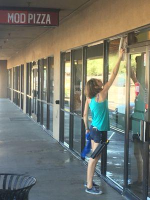 My beautiful wife cleaning windows at MOD Pizza.