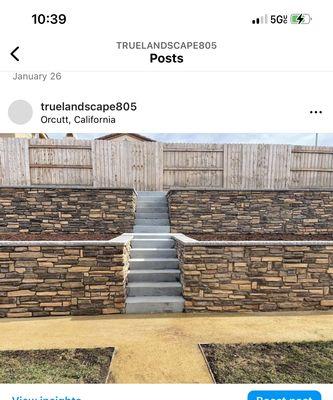 Retaining wall with stone veneer