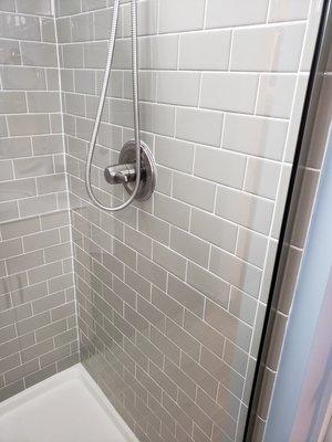 Lovely gray subway tile in a bathroom shower remodel