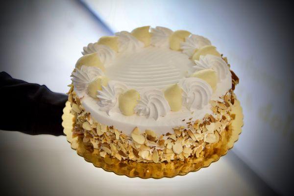 Rum cake - vanilla sponge cake soaked in rum layered with custard and chocolate chantilly cream.