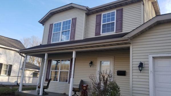 Completed Pressure washing job. Siding, gutters, facia, soffits, storm door, garage door, porch, walkway,  driveway, posts and awning